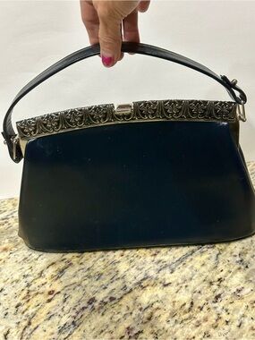 Classic Black Leather Wristlet Clutch with Ornate Silver Accent